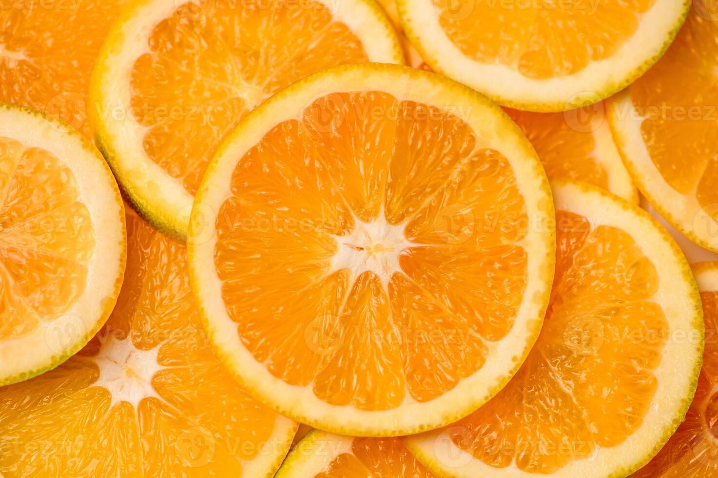 Closeup of sliced juicy oranges textured background photo