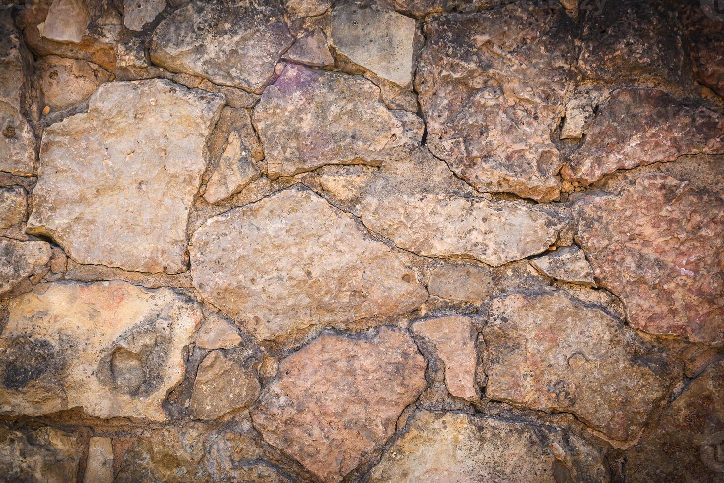 Stone wall texture background - with stones of different sizes 2 photo
