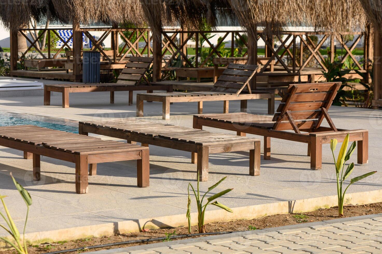 sun loungers near the cafe and pool in a residential complex 2 photo