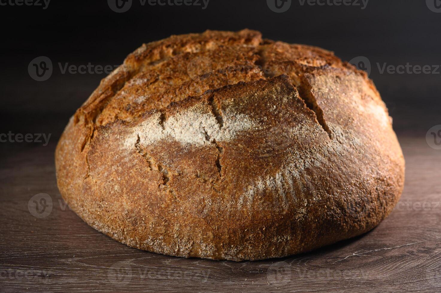 appetizing homemade whole grain bread on a wooden table 11 photo