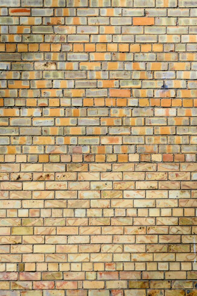 yellow brick wall in spring. Stones for a modern concept background with copy space photo