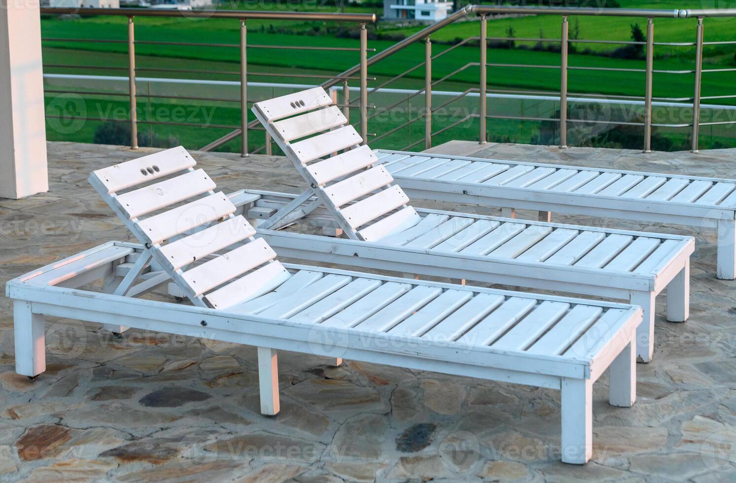 sun loungers near the rooftop pool at sunset in winter in Cyprus 1 photo