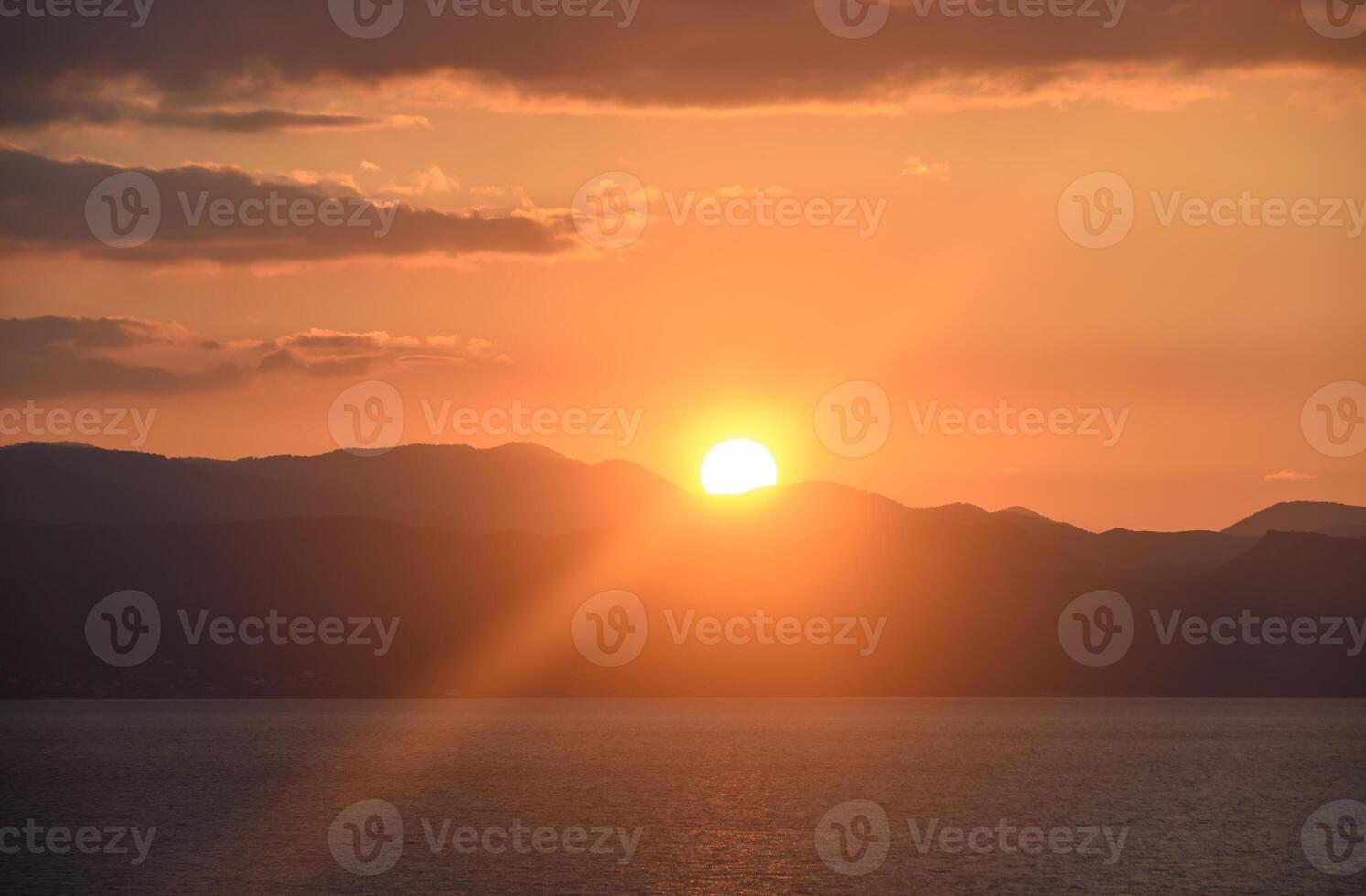 the sun sets behind the mountains in winter in Cyprus 10 photo