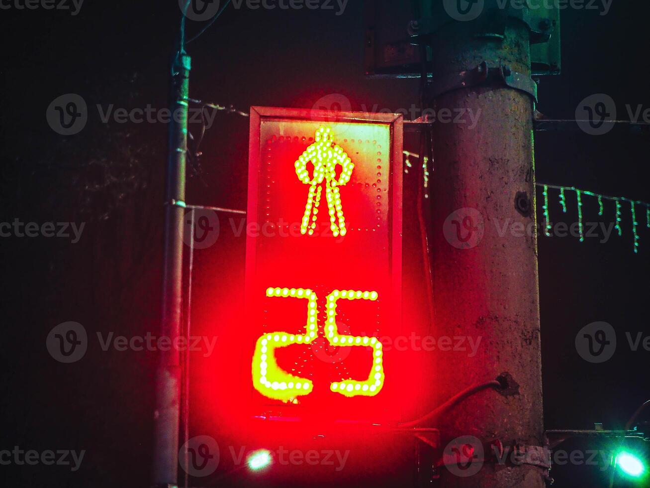 night traffic light for pedestrians with number 25, twenty five photo