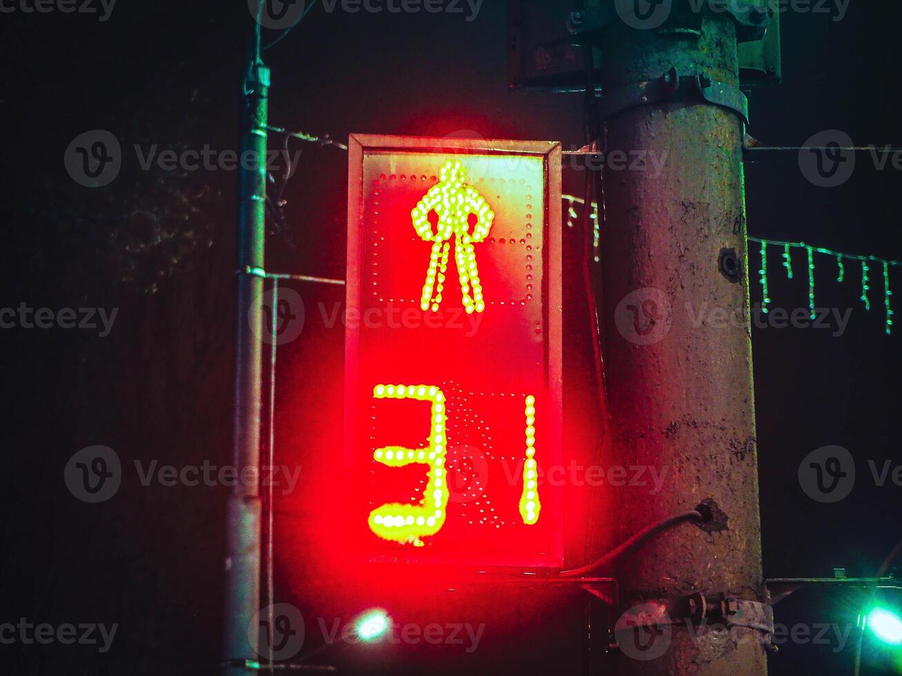 night traffic light for pedestrians with number 31, thirty one photo