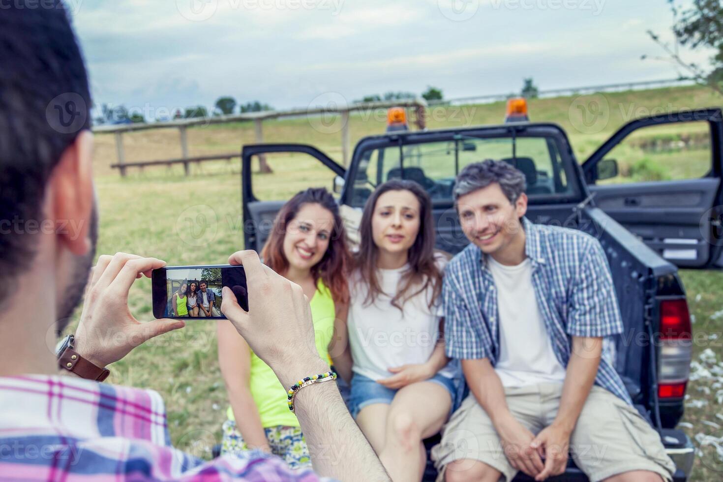 Happy group of young people takes a selfie photo