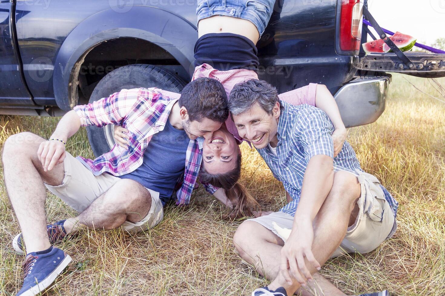 group of young adults make crazy and kisses photo