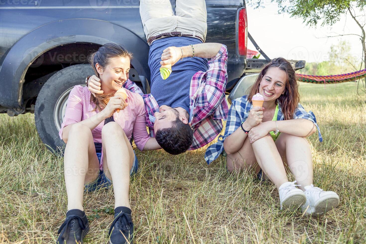 group of young adults make crazy and eat the ice cream photo