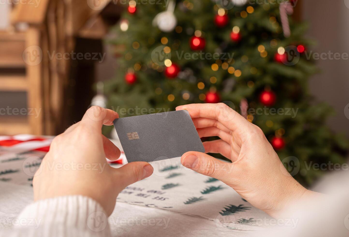 Christmas shopping with credit card. Woman holding online payment gift card. Holiday business pay photo