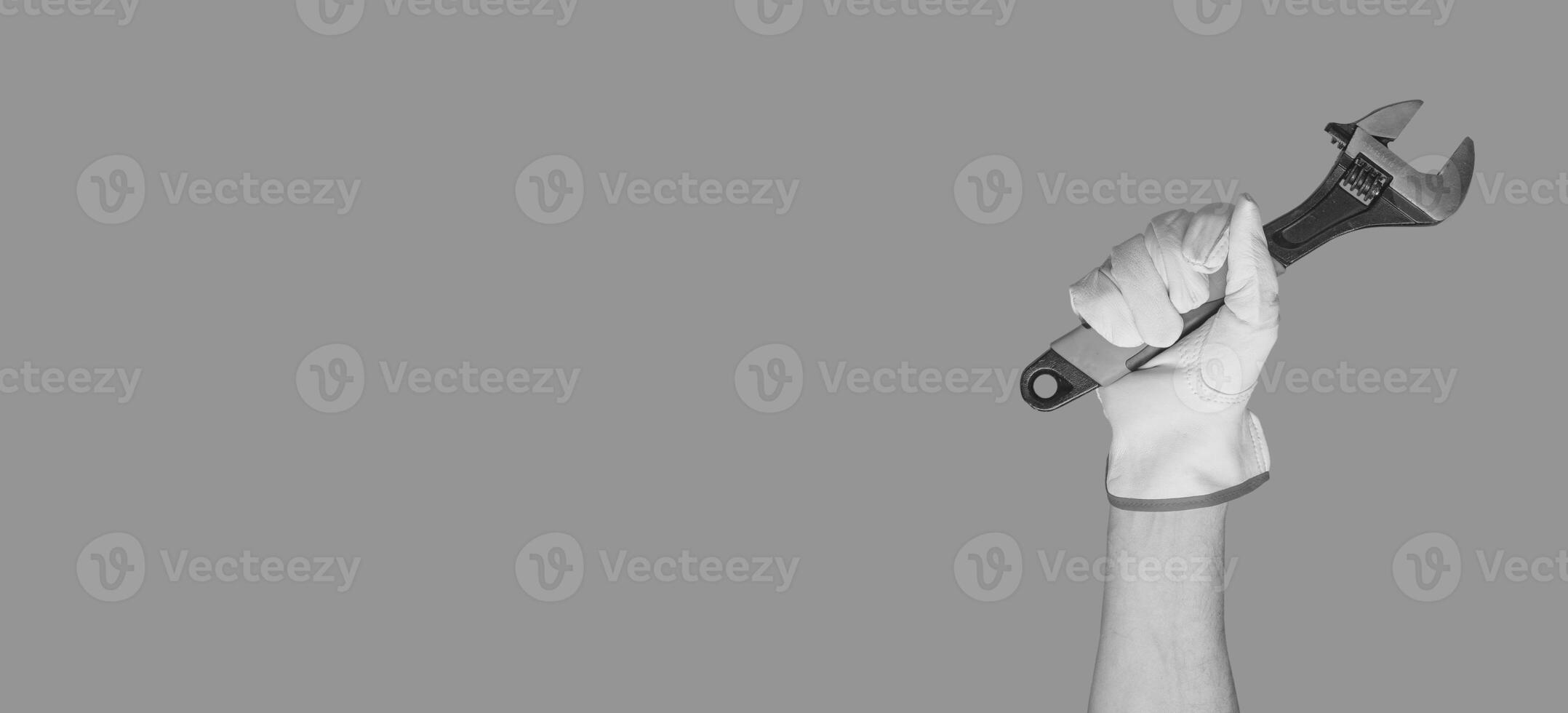 Wrench tool in hand. Repair banner background photo