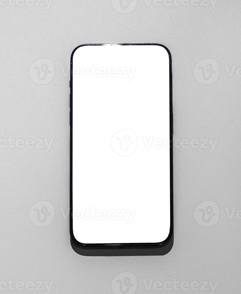 Modern mobile phone, blank screen smartphone. White technology device, empty communication telephone photo