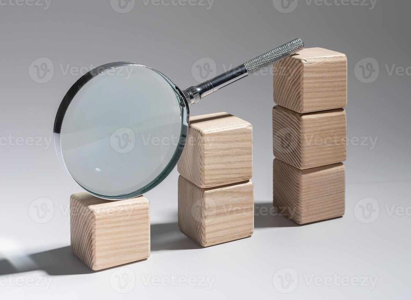 Financial graph analysis, market research with magnifying glass. Economic study, business analytics, photo