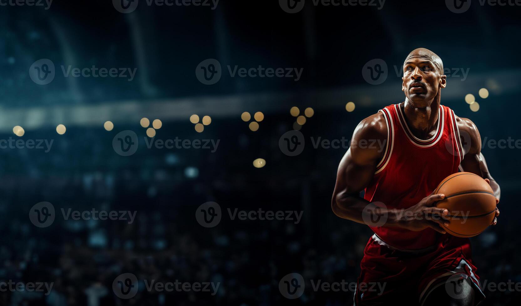 A basketball player in a red uniform holds a ball in his hands. Background with space for text photo
