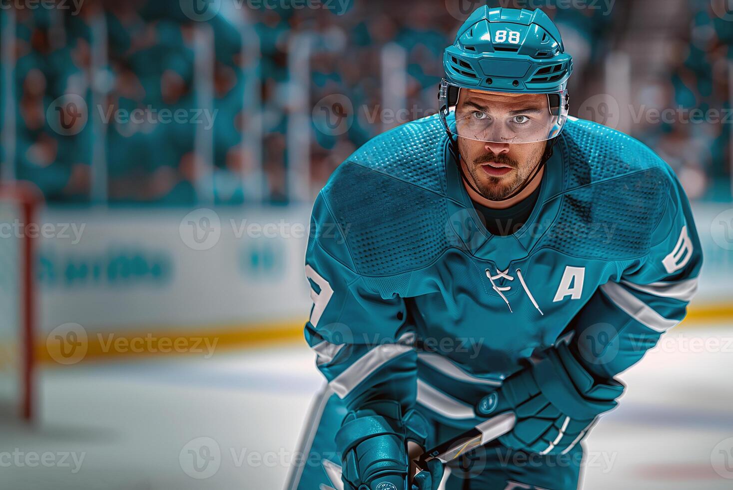 A hockey player in a turquoise uniform and helmet. Playing in the hockey arena photo