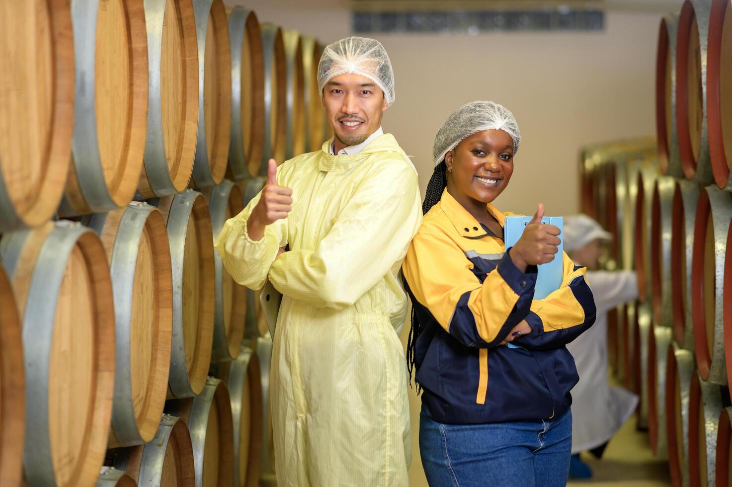 Professional winemaker controlling wine making process and quality at winery factory photo