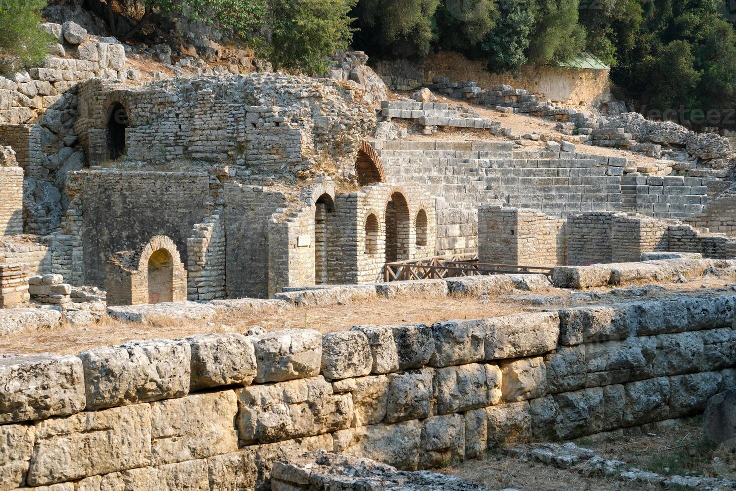 Ruins of the Great Basilica in Butrint National Park, Buthrotum, Albania. Triconch Palace at Butrint Life and death of an ancient Roman house Historical medieval Venetian Tower surrounded photo