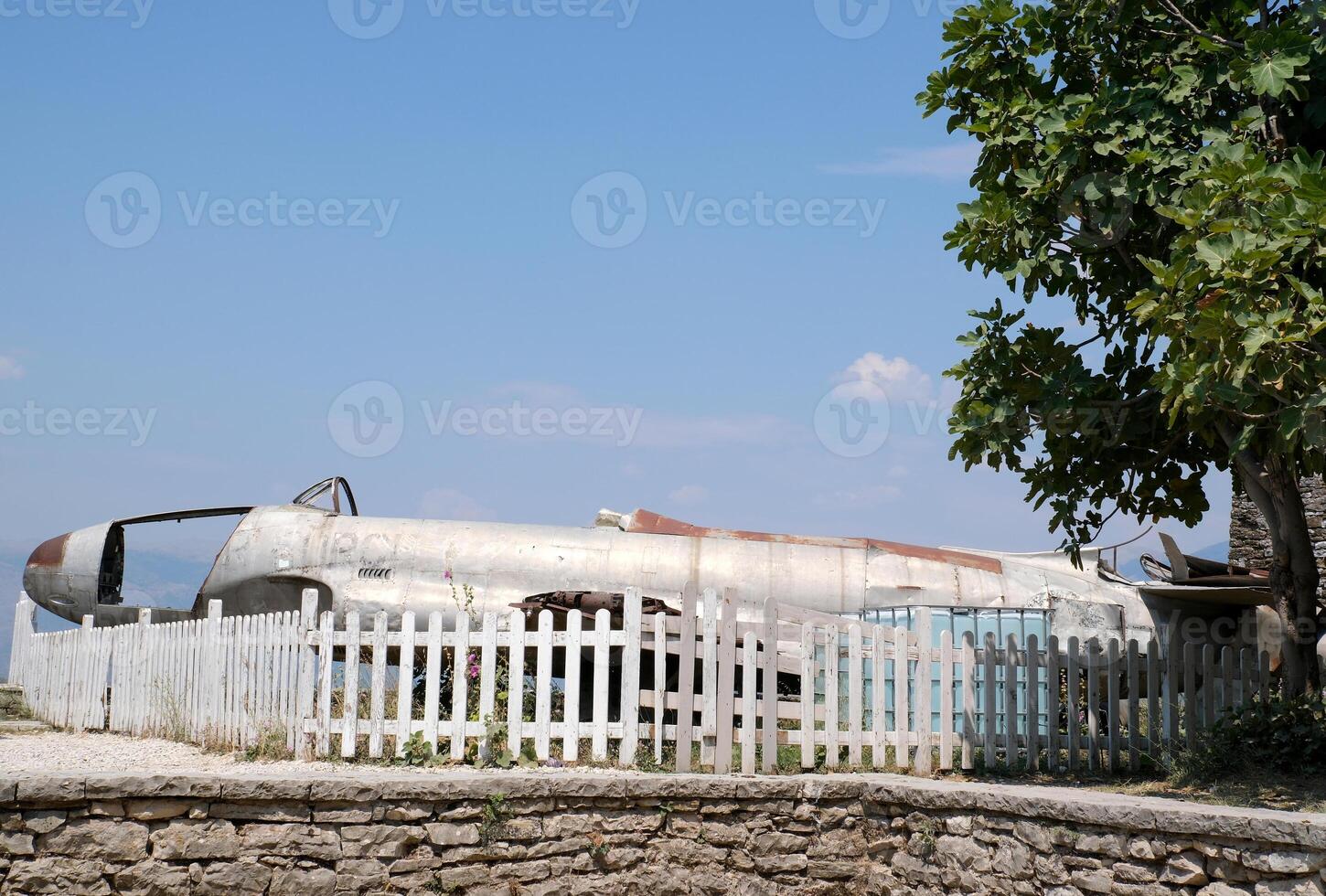 Fortress in Gjirokastra a huge stone building on a high mountain in Albania with a clock the history of the Middle Ages a beautiful view from the stone city to the ancient village photo
