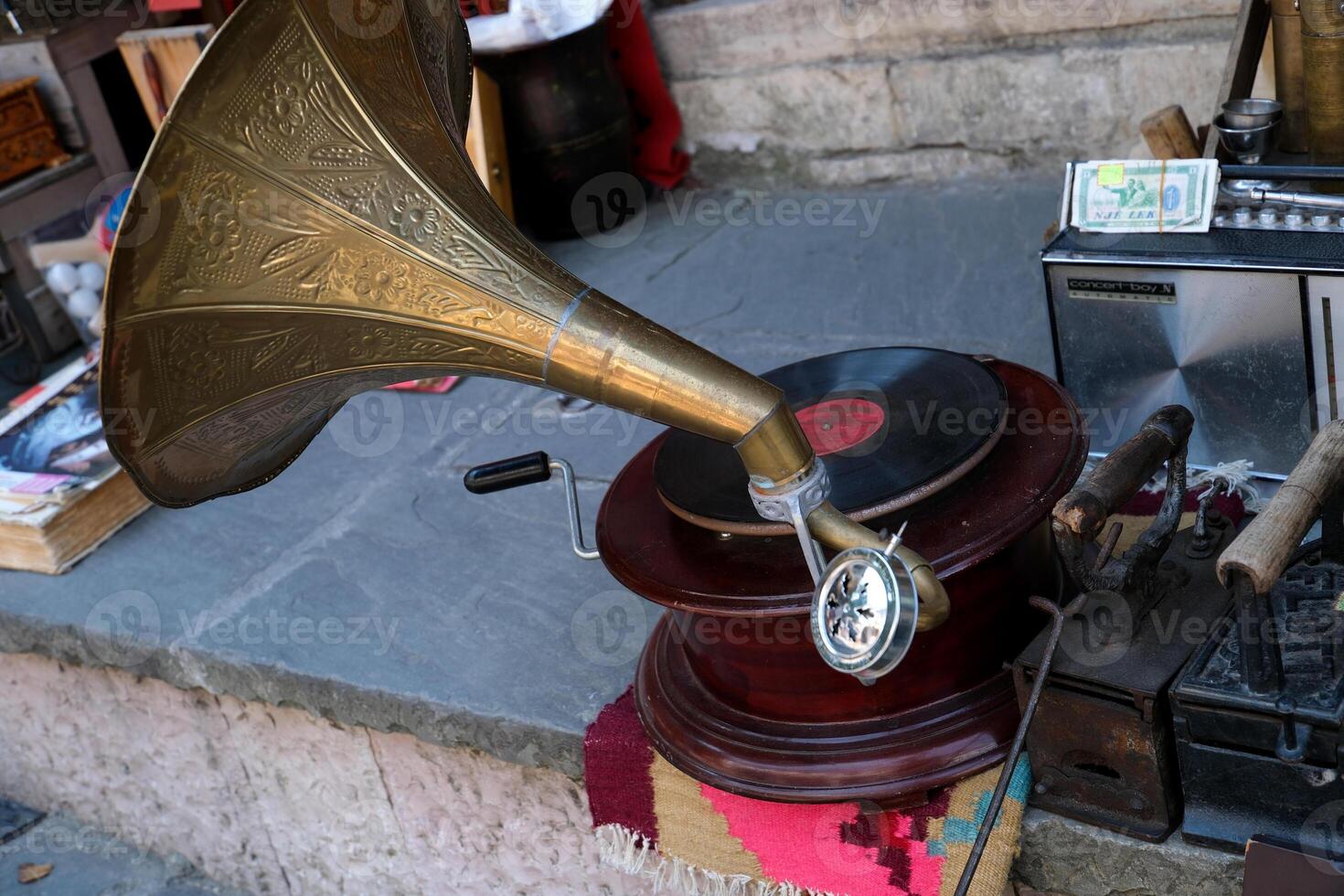 Albania Herokrast on the ground an old gramophone with a record of an ancient vintage musical instrument is for sale photo