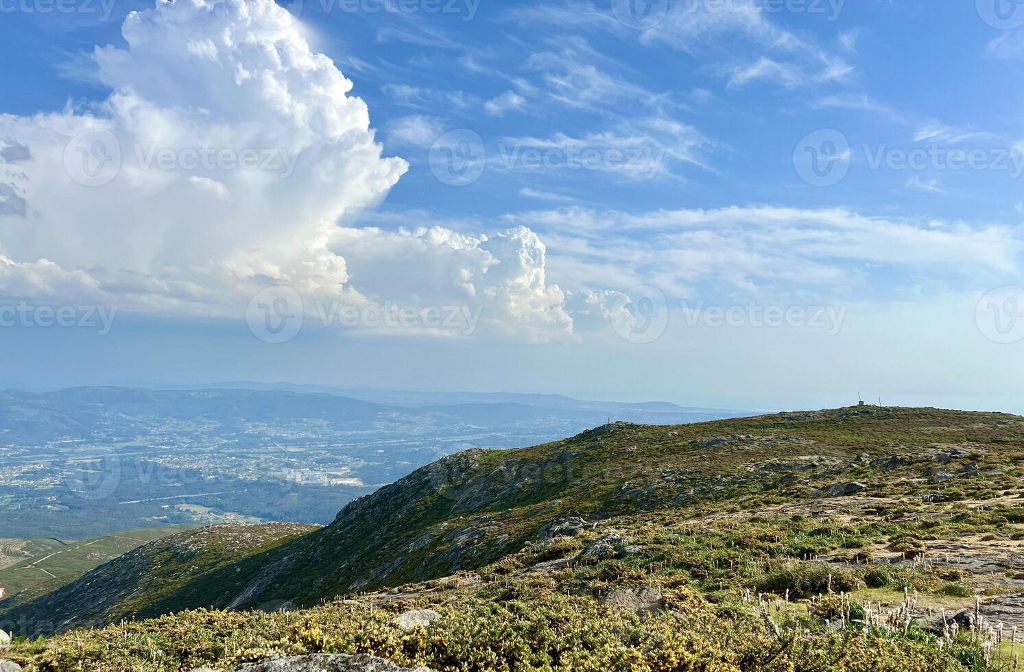 the view of the highest mountain in Portugal on the city of viana do castelo, you can also see huge white clouds on which you can write text and captions, as well as advertising photo