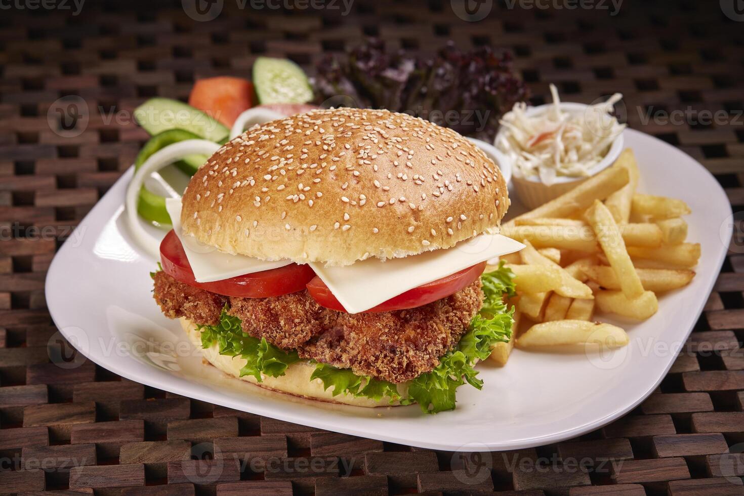 Chicken Fillet Sandwich or burger with fries and salad served in dish isolated on table side view of middle east food photo