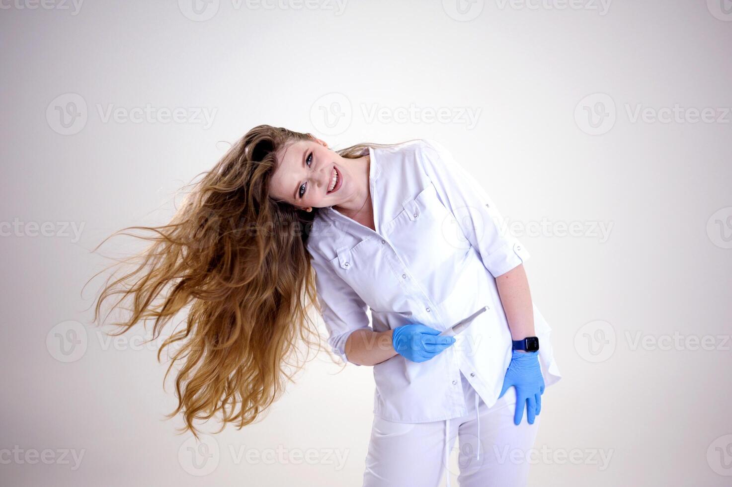 Woman in peignoir with toothbrush on grey background photo