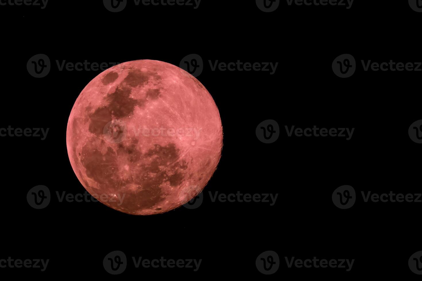 The Crimson Full Moon on black background photo