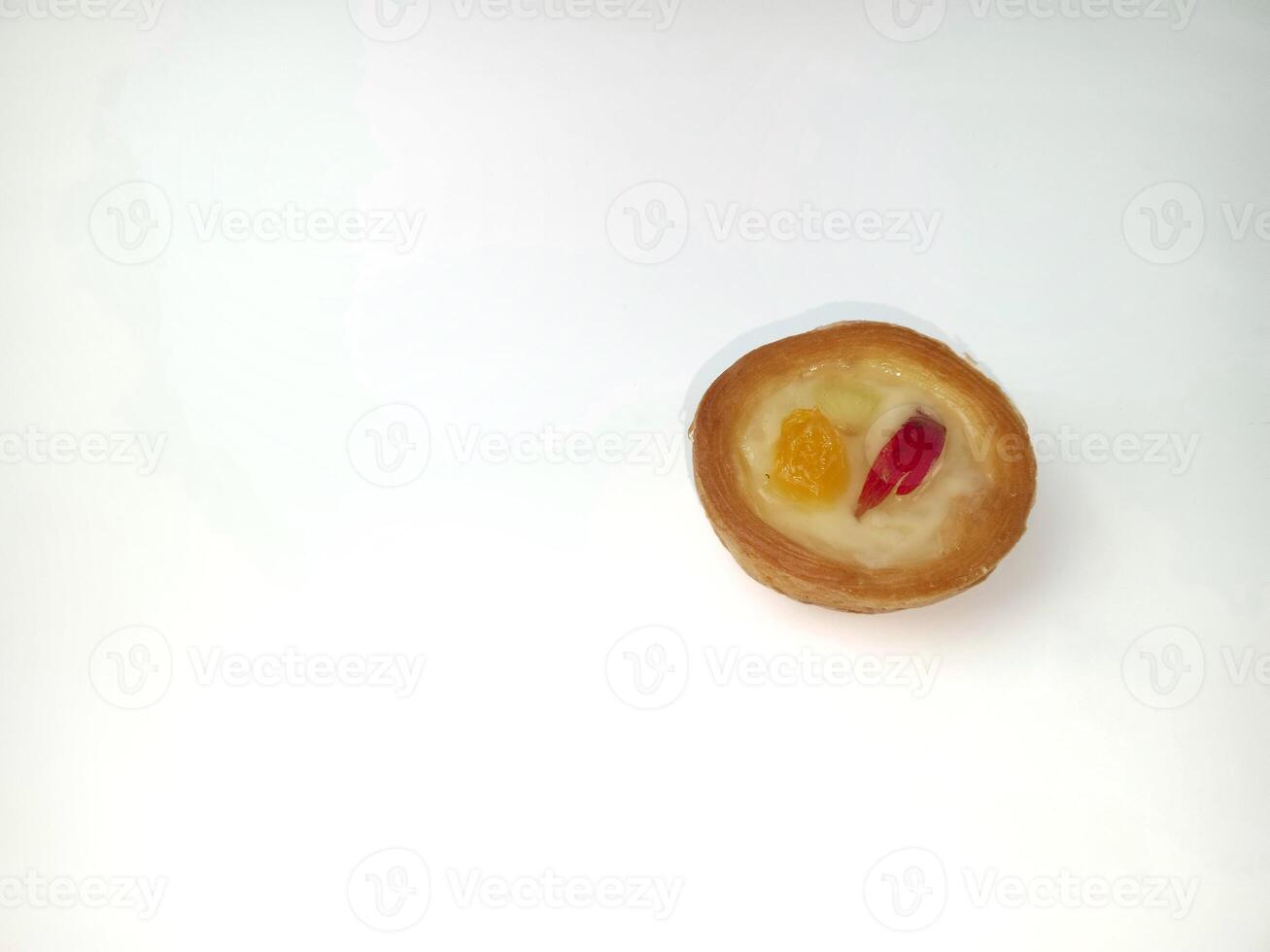 Delicious mini fruit tart isolated on white background with top view shoot. Soes cake with fruit topping. photo