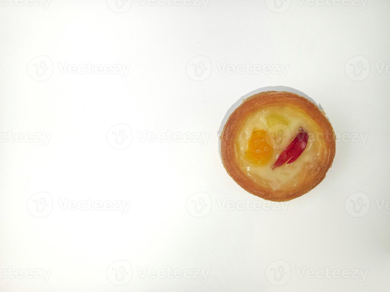 Delicious mini fruit tart isolated on white background with top view shoot. Soes cake with fruit topping. photo