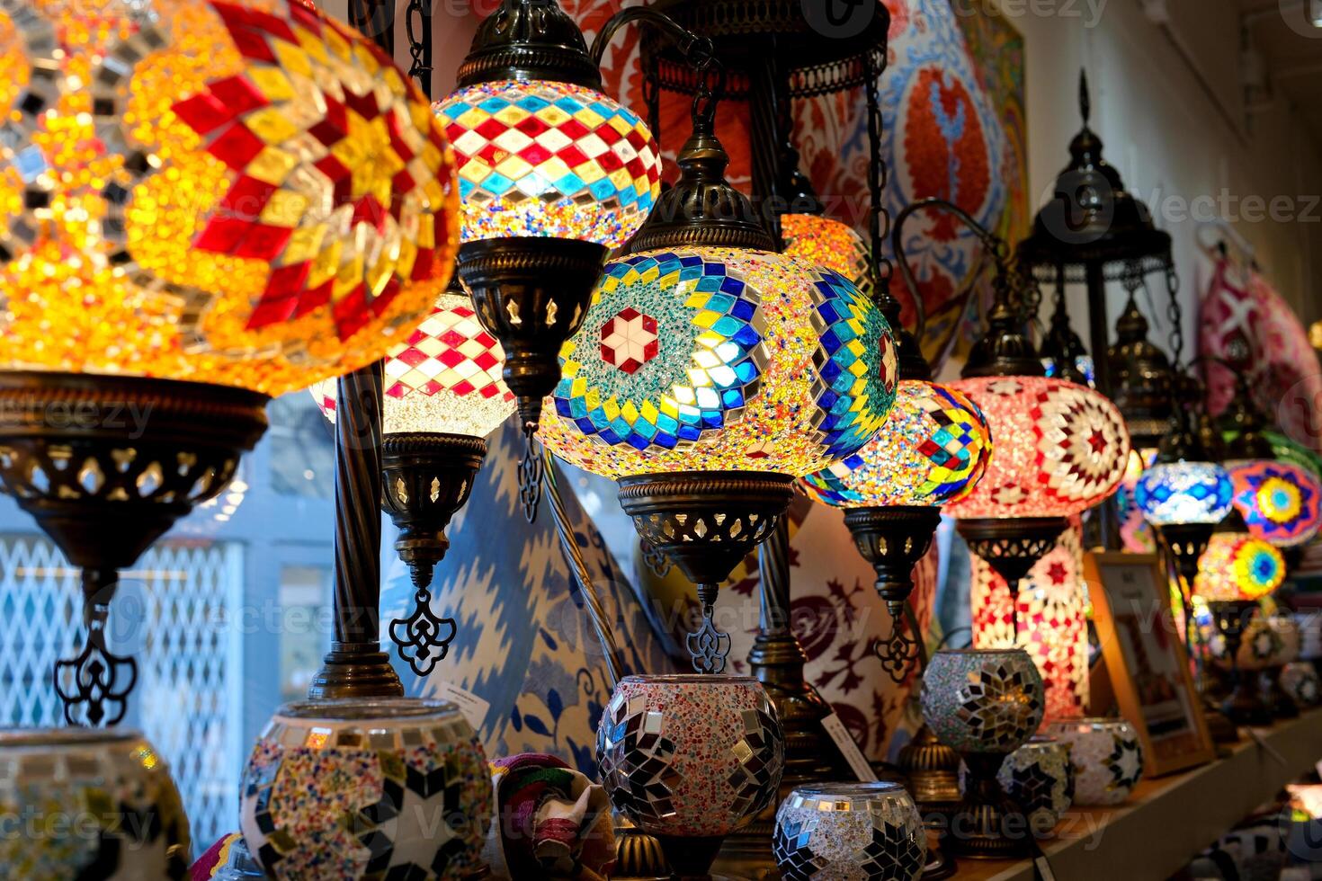 Turkish lamps in the store on the counter are multi-colored lamps turned on And glow in a mosaic shimmer in the frame the camera slowly swims by filming them Granville Island photo