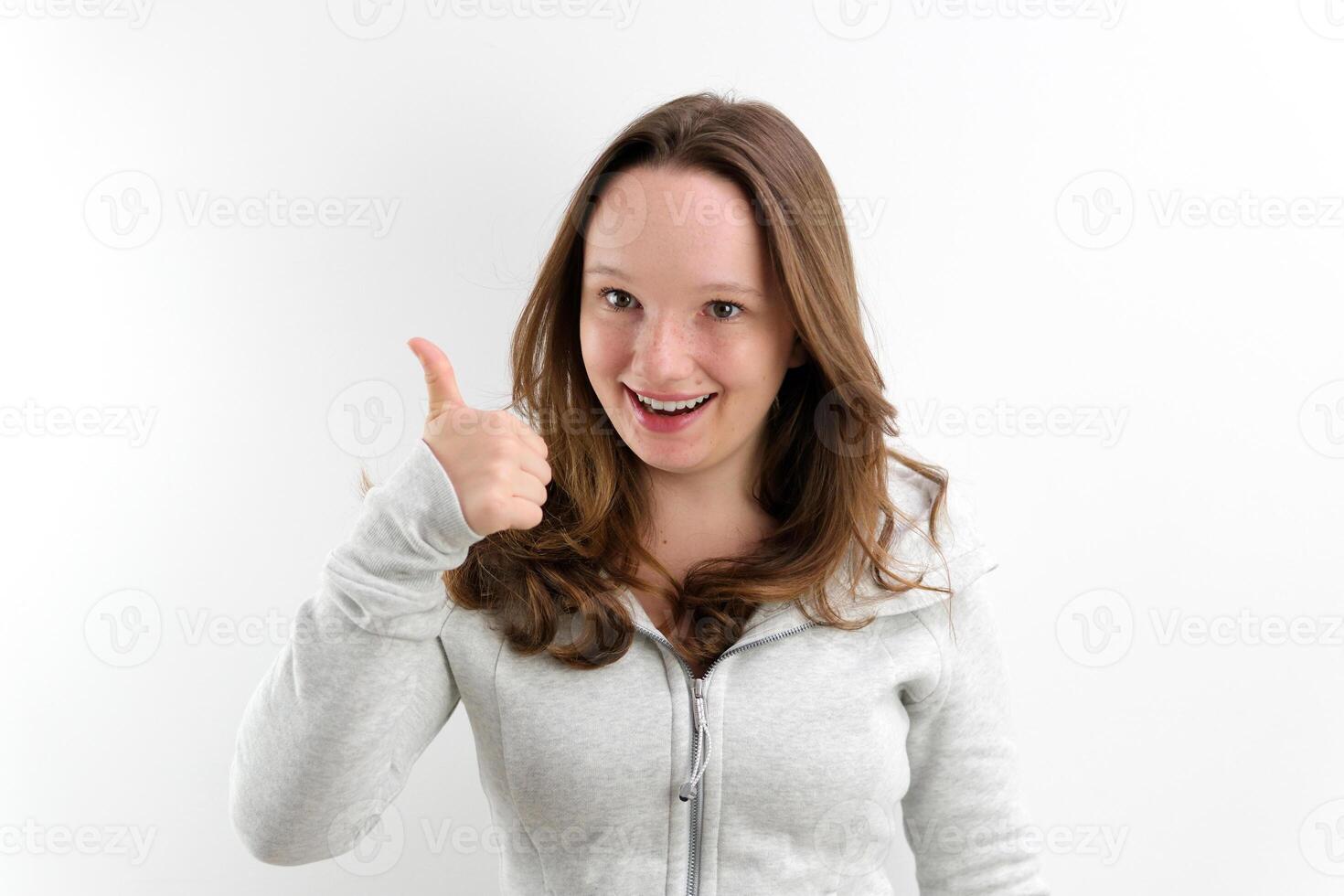 The joyful young woman pointing a finger photo
