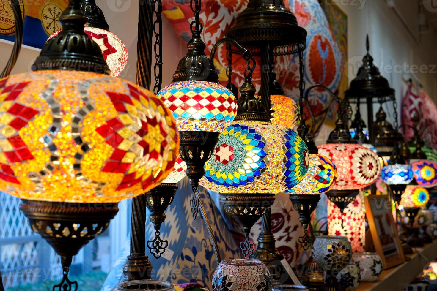 Multi-colored Turkish mosaic lamps on the ceiling market in the famous Grand Bazaar in Istanbul, Turkey photo