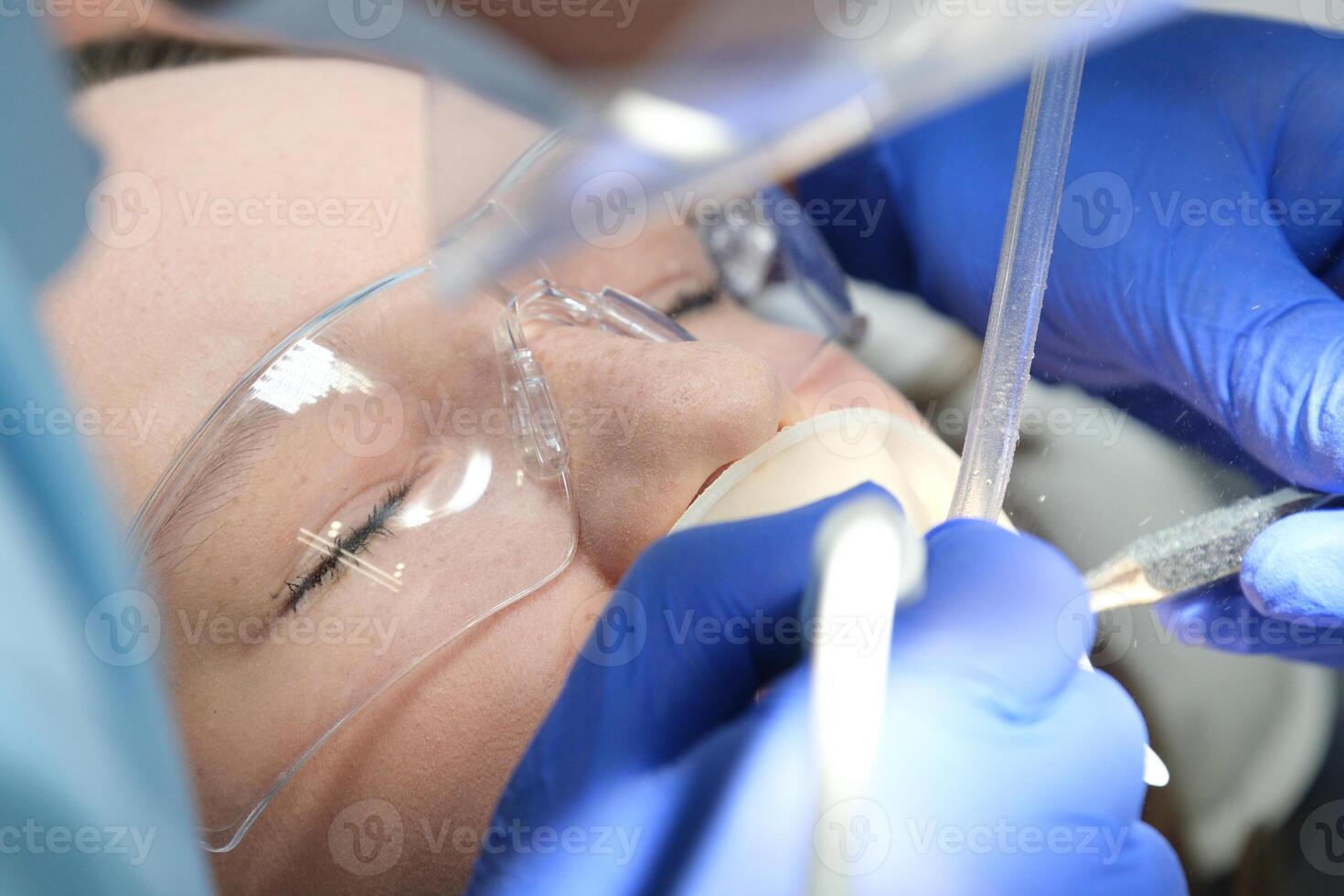 young girl showing heart with hands dental office brushing teeth whitening dental procedures doctor and nurse saliva suction and other latest technologies in blue gloves and masks self care favorite photo