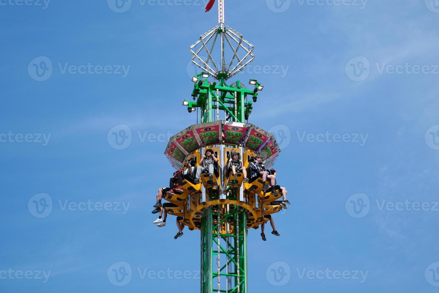 fall tower swing free fall in the sun shoot a beautiful on your mobile phone Cloverdale rodeo country fair get back to Country family events the rays of sun break through the swing ride, great photo