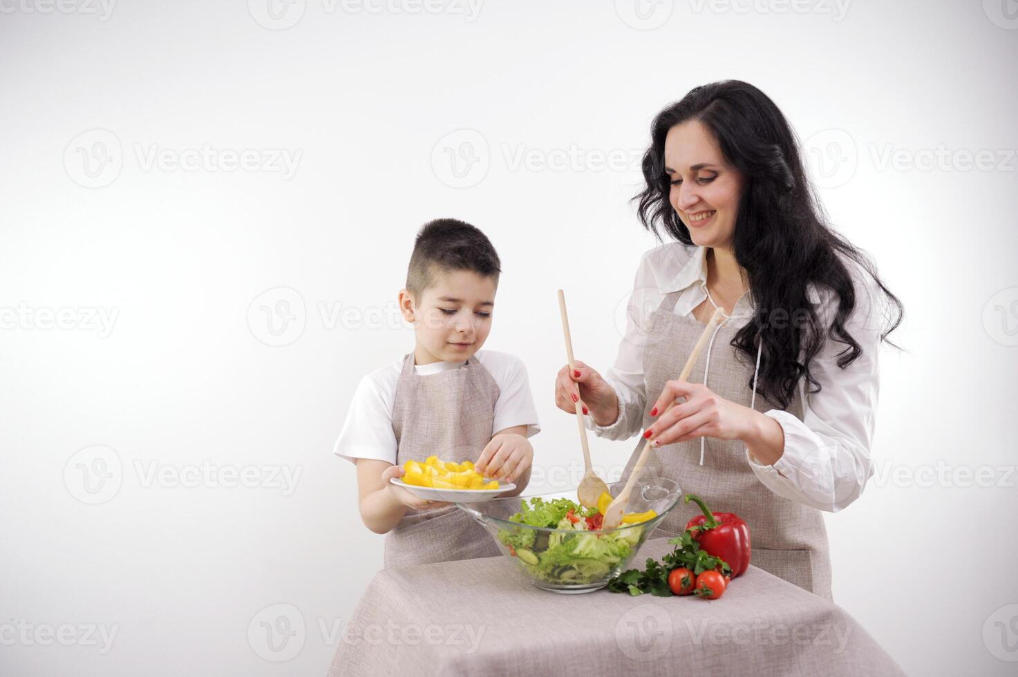 Woman and little boy having a healthy salad for snack photo