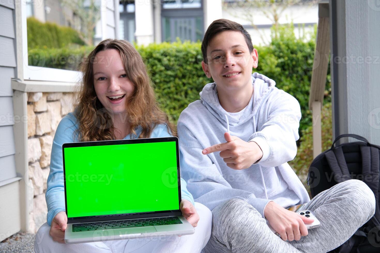 prompting solution of problem boy and girl sitting on street doing school assignments portfolio notebook folder with sheets pencil Two cups of tea coffee pleasant relationship teenager boy photo