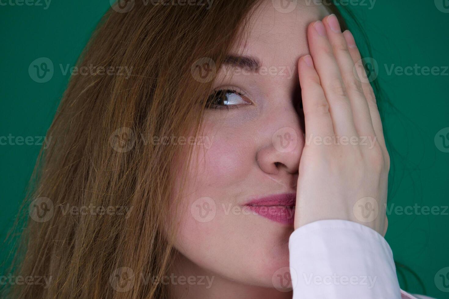 happy girl covers her hand eye, in the house photo