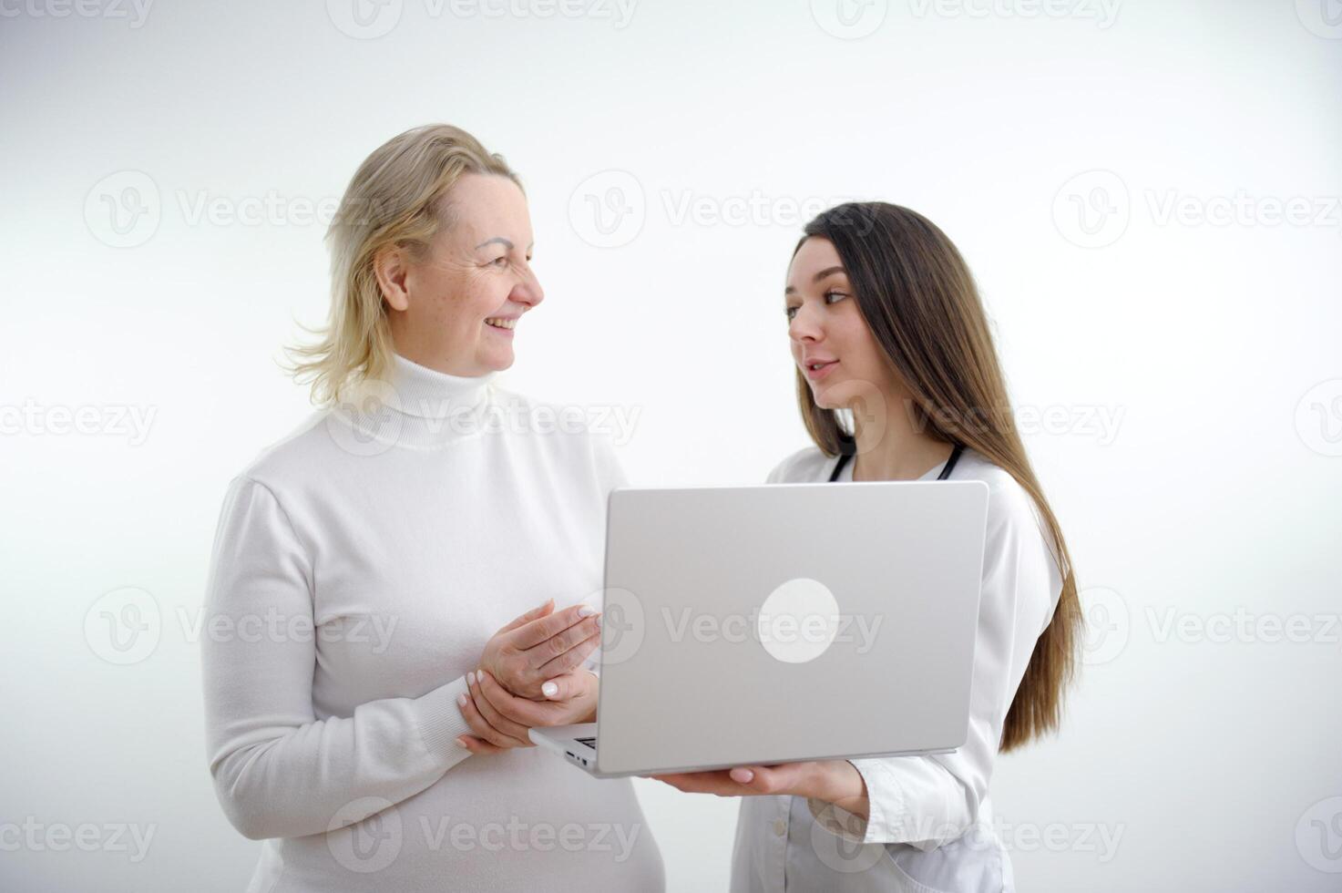 Doctor and patient discussing something while sitting at the table . Medicine and health care concept. Doctor and patient photo