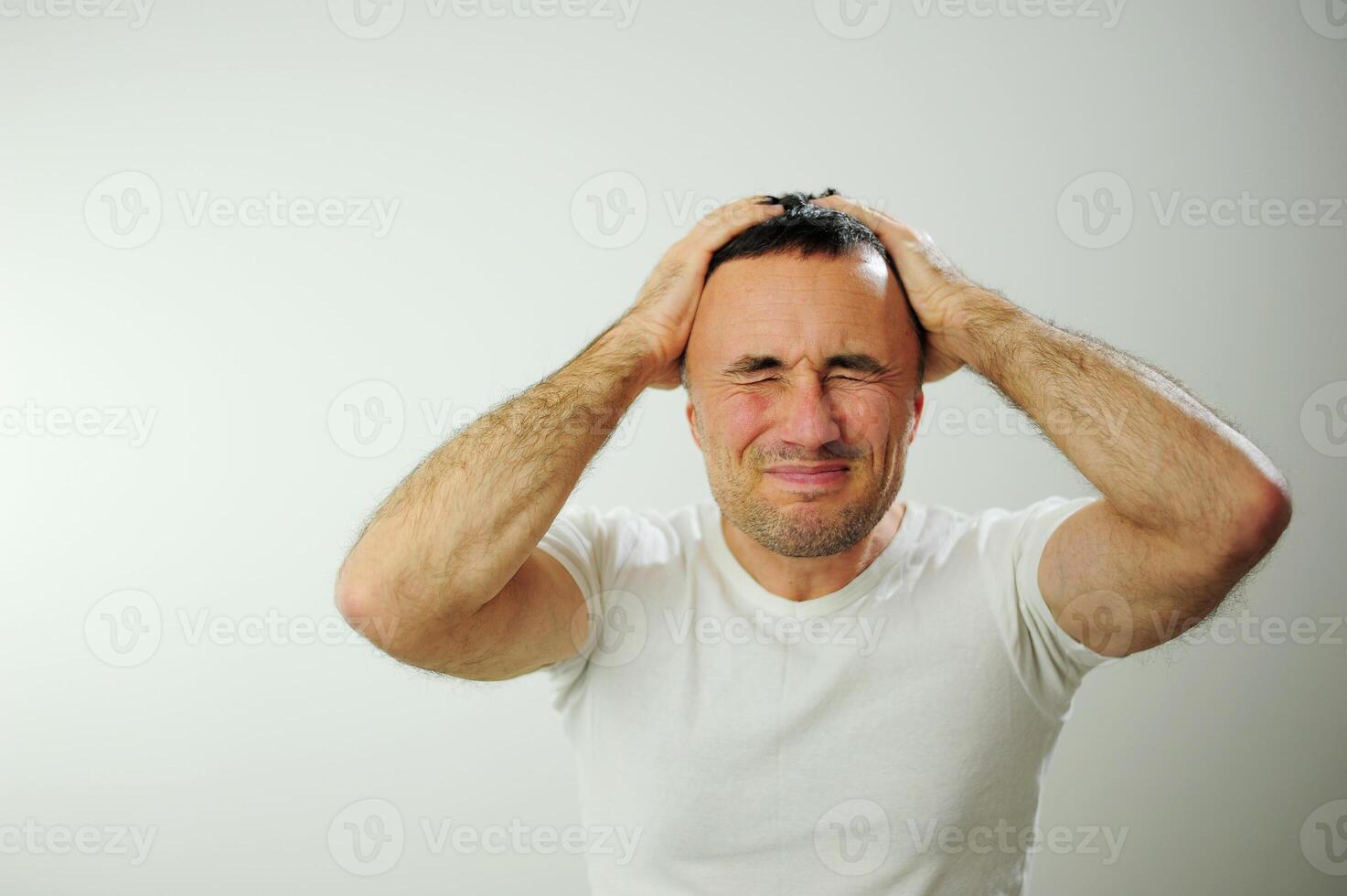 Adult man upset he put his hands on his face Prayer experience crying negative emotions suffering loneliness Studio on white background Close-up space for text Waiting for the end of the war photo