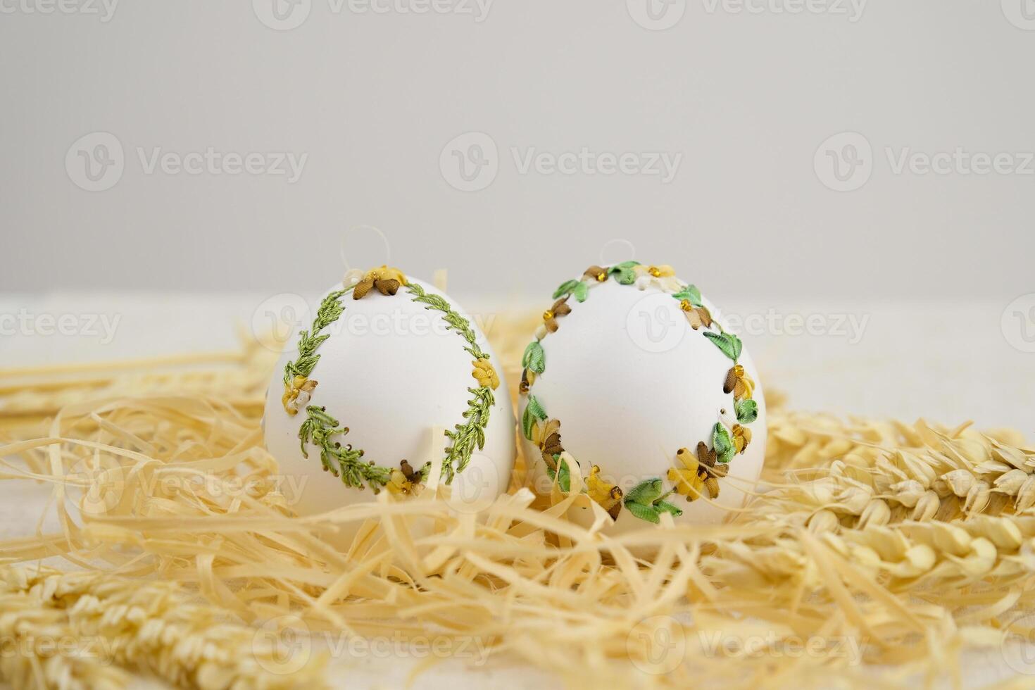 Colourful Easter eggs with different patterns aligned on a blue background photo