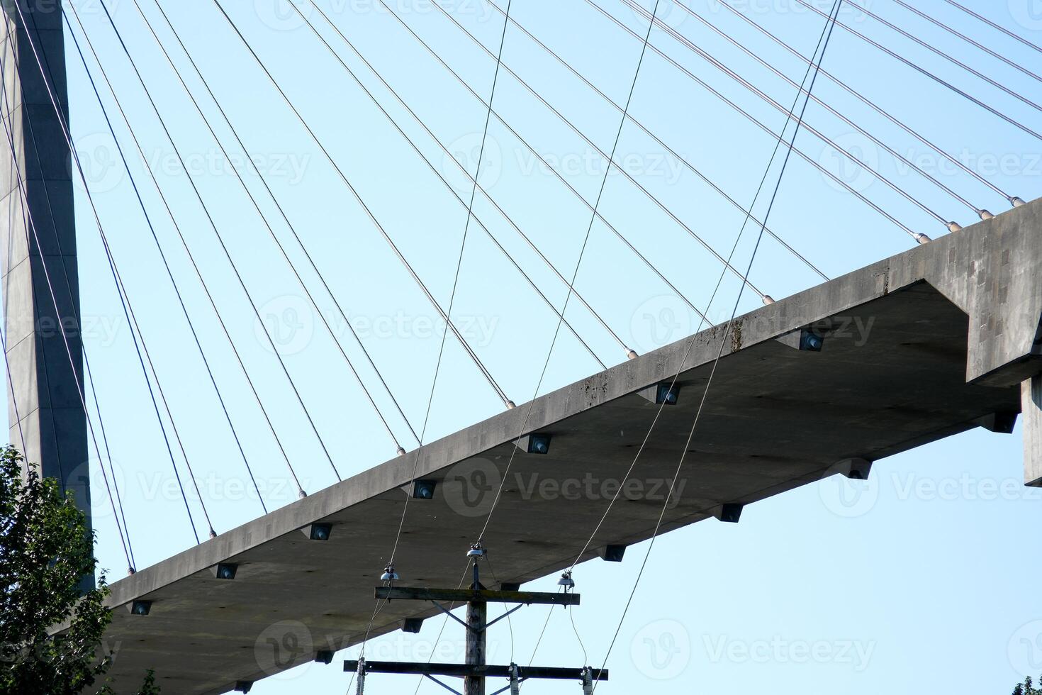 Skytrain Bridge in New Westminster and Surrey, Greater Vancouver, British Columbia, Canada. Sunset Sky. Brownsville Bar Park. photo