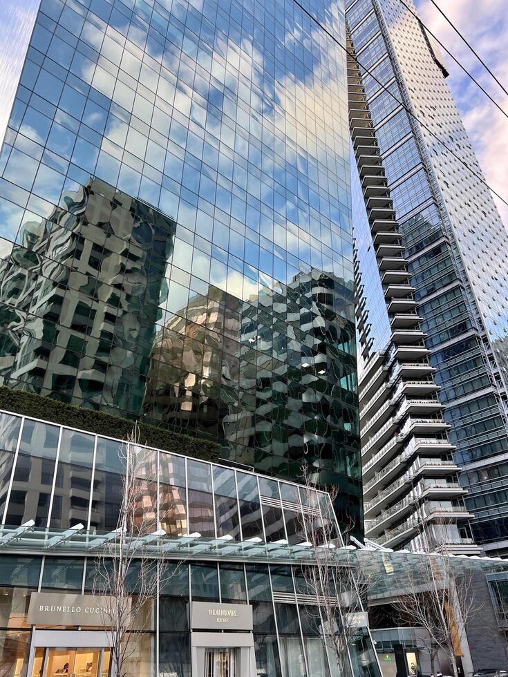 Vancouver Canada 2023 metropolis big city life skyscrapers tall new modern and old houses office City Rush Hour Traffic Vancouver Architecture Timelapse low angle view of skyscrapers photo