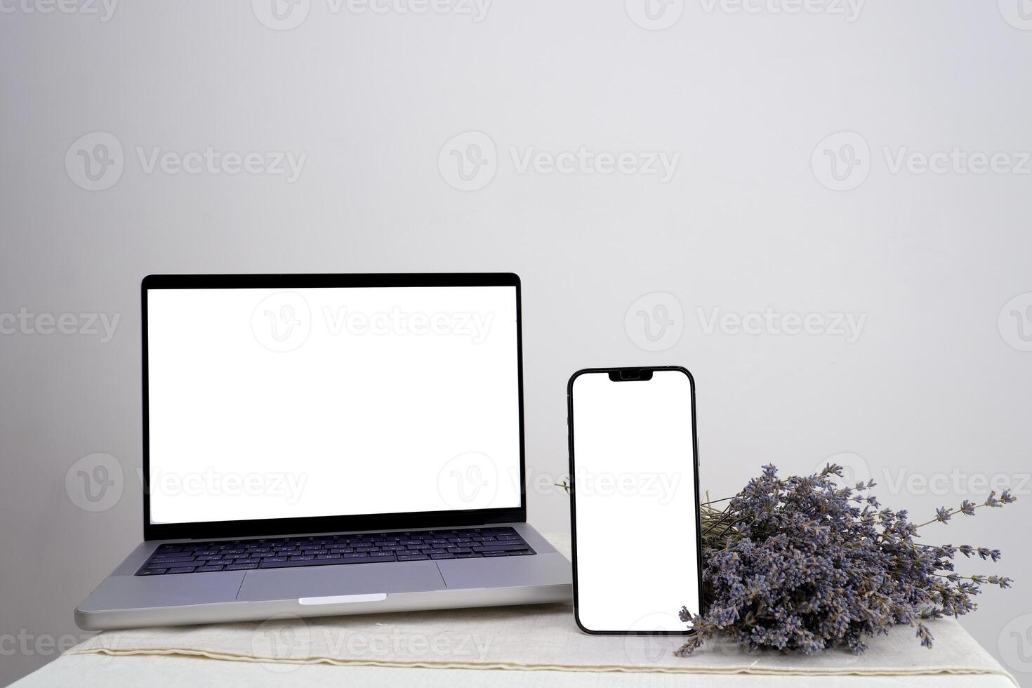 using mobile smart phone, black screen phone, sms, calls, office desk resume info and blank screen on tablet, purple lavender flower find work concept. View office desk. photo