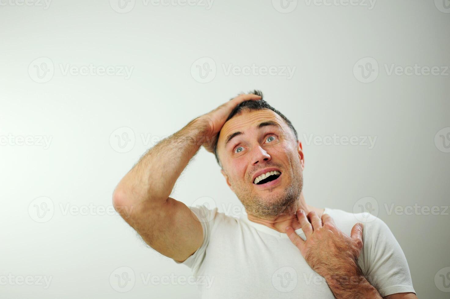 Portrait of man surprised face expression Surprised male hipster, keeps mouth opened, being stupefied as advertises something, Omg concept shouting WOW, with copy space fot your text. Shock content photo