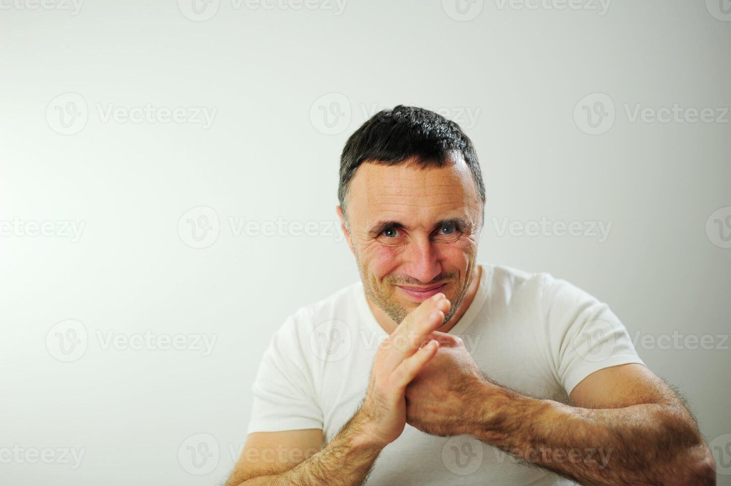 Hit from the left adult man is angry and hits his hand with his fist his hairy strong hands he has black hair and gray Dissatisfaction expressing negative emotions You will get what you deserve photo