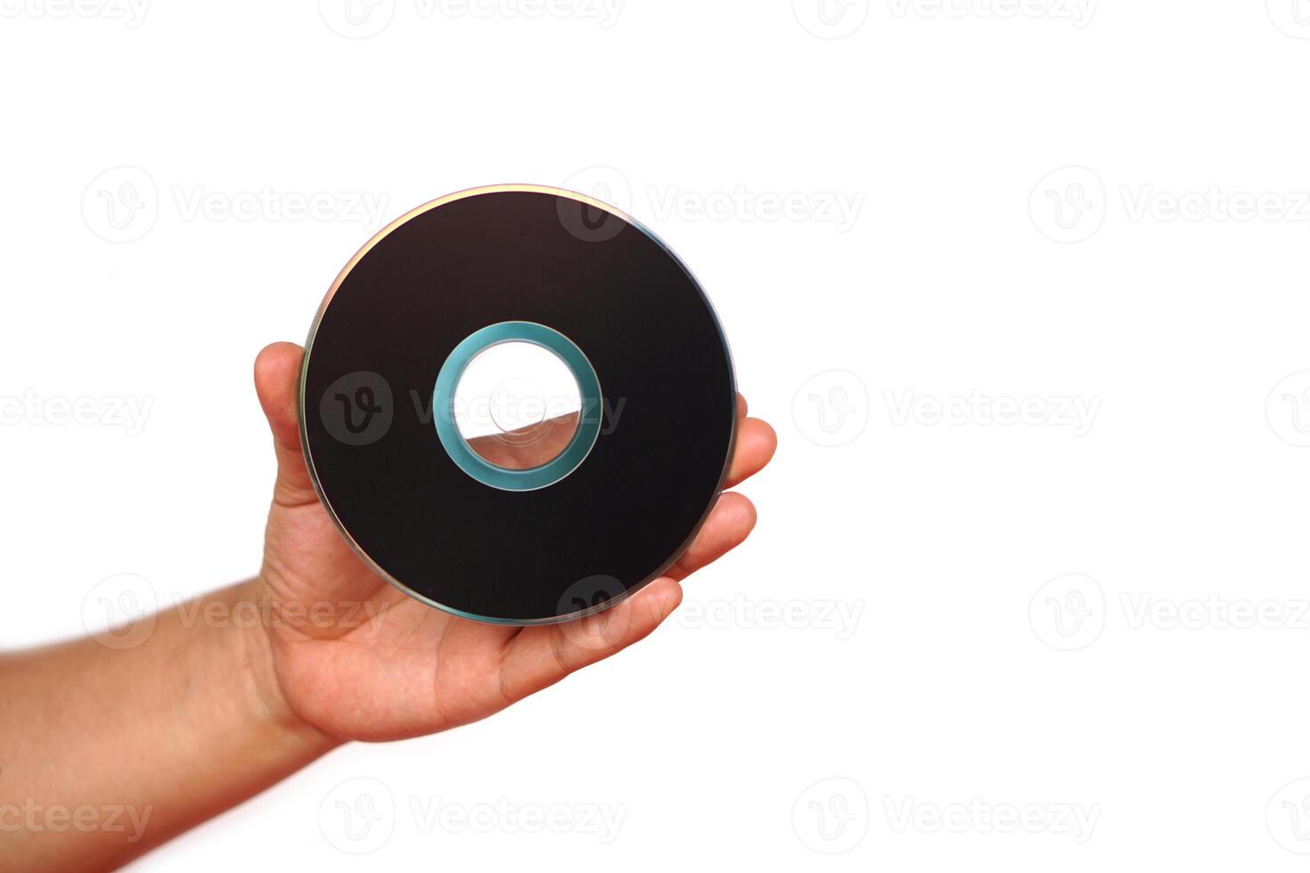 Close up hand hold CD compact disc, DVD, isolated on white background. Concept, tool, equipment for setup or install programs in computer or music, movie for dvd player. photo