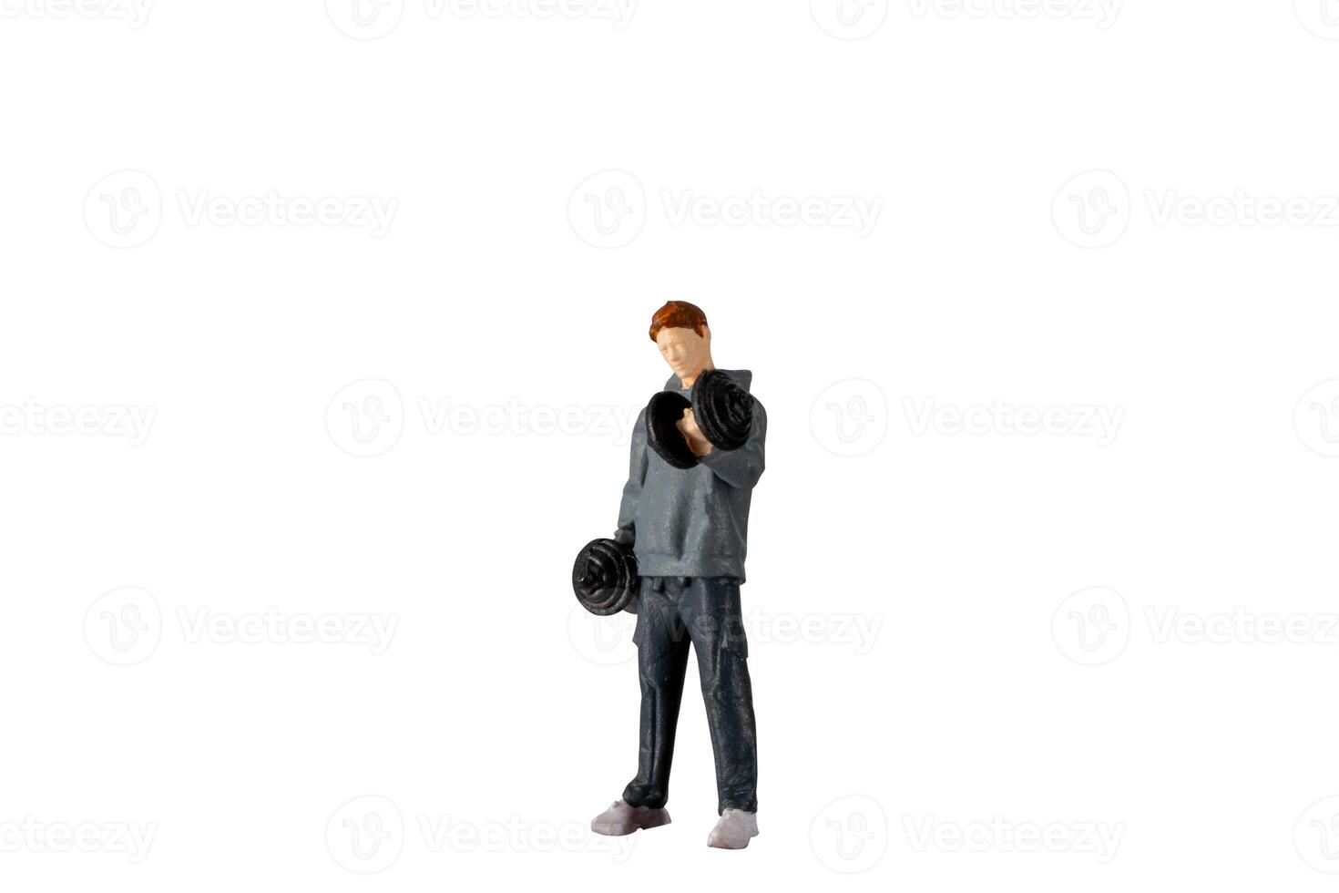Miniature people , Young man lifting weights Isolated on white background with clipping path photo