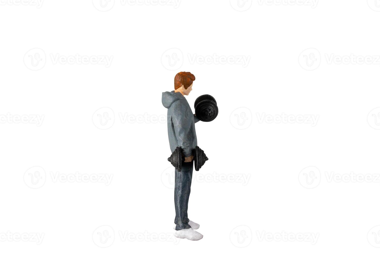 Miniature people , Young man lifting weights Isolated on white background with clipping path photo
