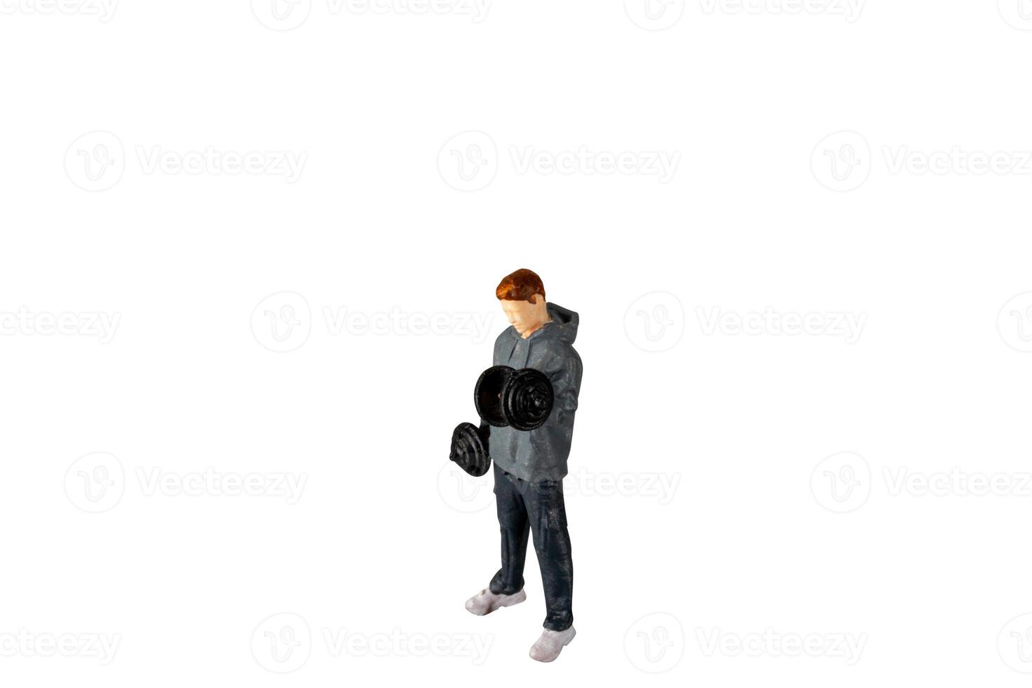 Miniature people , Young man lifting weights Isolated on white background with clipping path photo