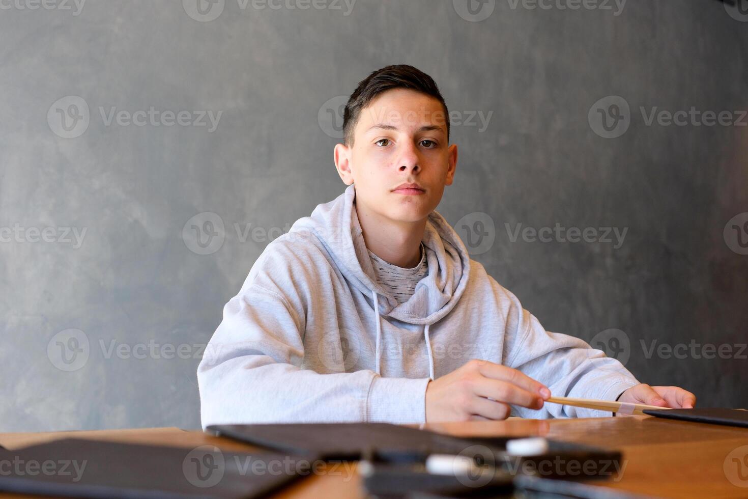 Young handsome man eating sushi sitting on the table thinking looking tired and bored with depression problems with crossed arms. photo