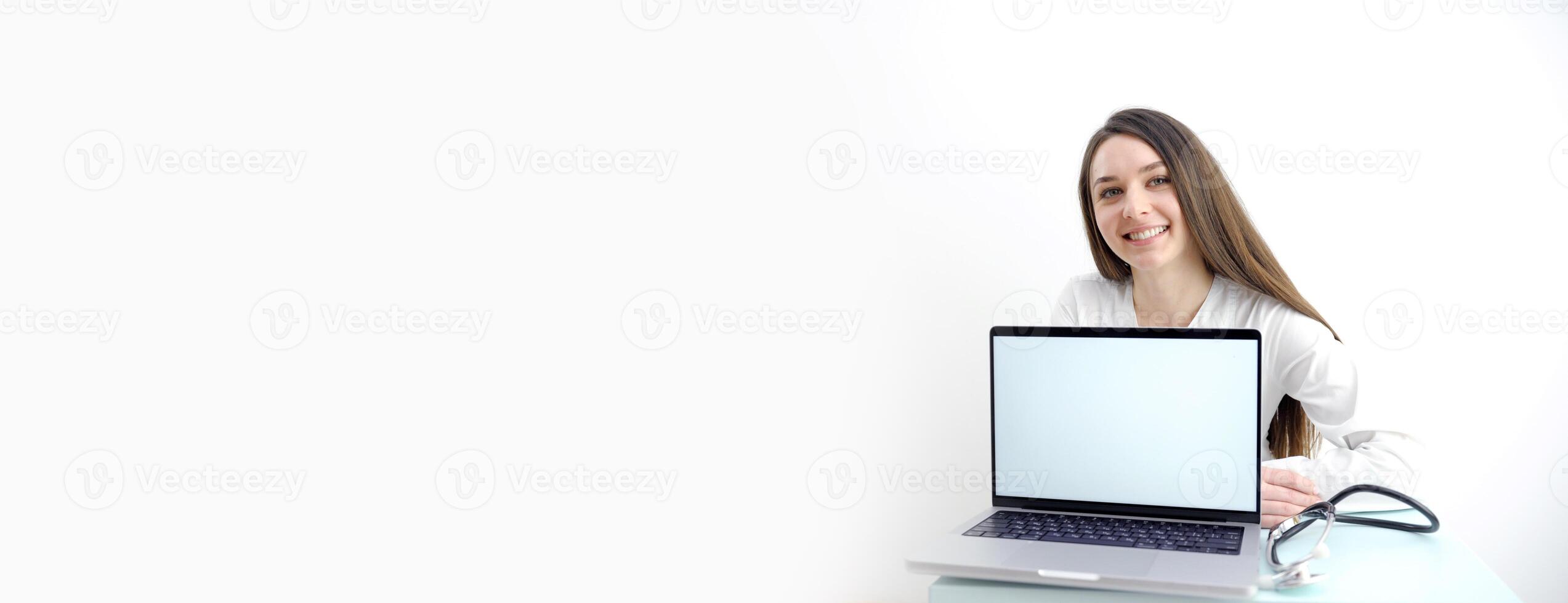 woman is holding laptop computer on white Doctor banner clipboard hospital wearing scrubs provide checkup, examine patient in clinic. Medical care, insurance, prescription, paper work or career banner photo